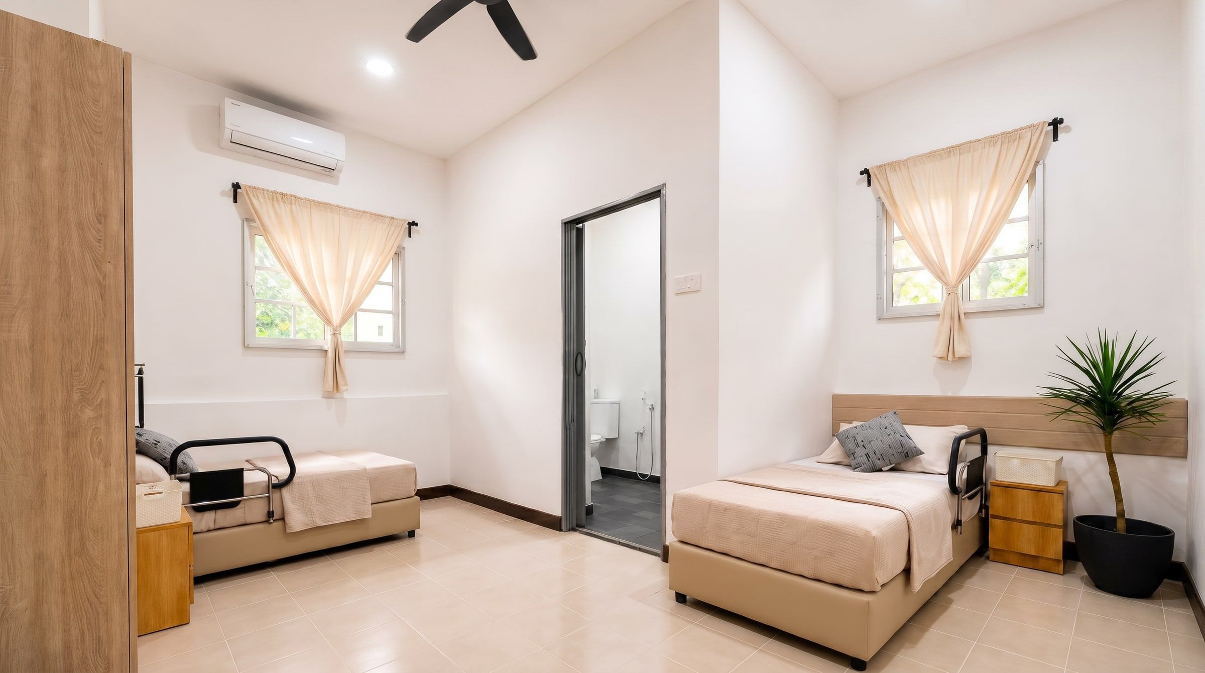 Resident room with its attached private bathroom door open