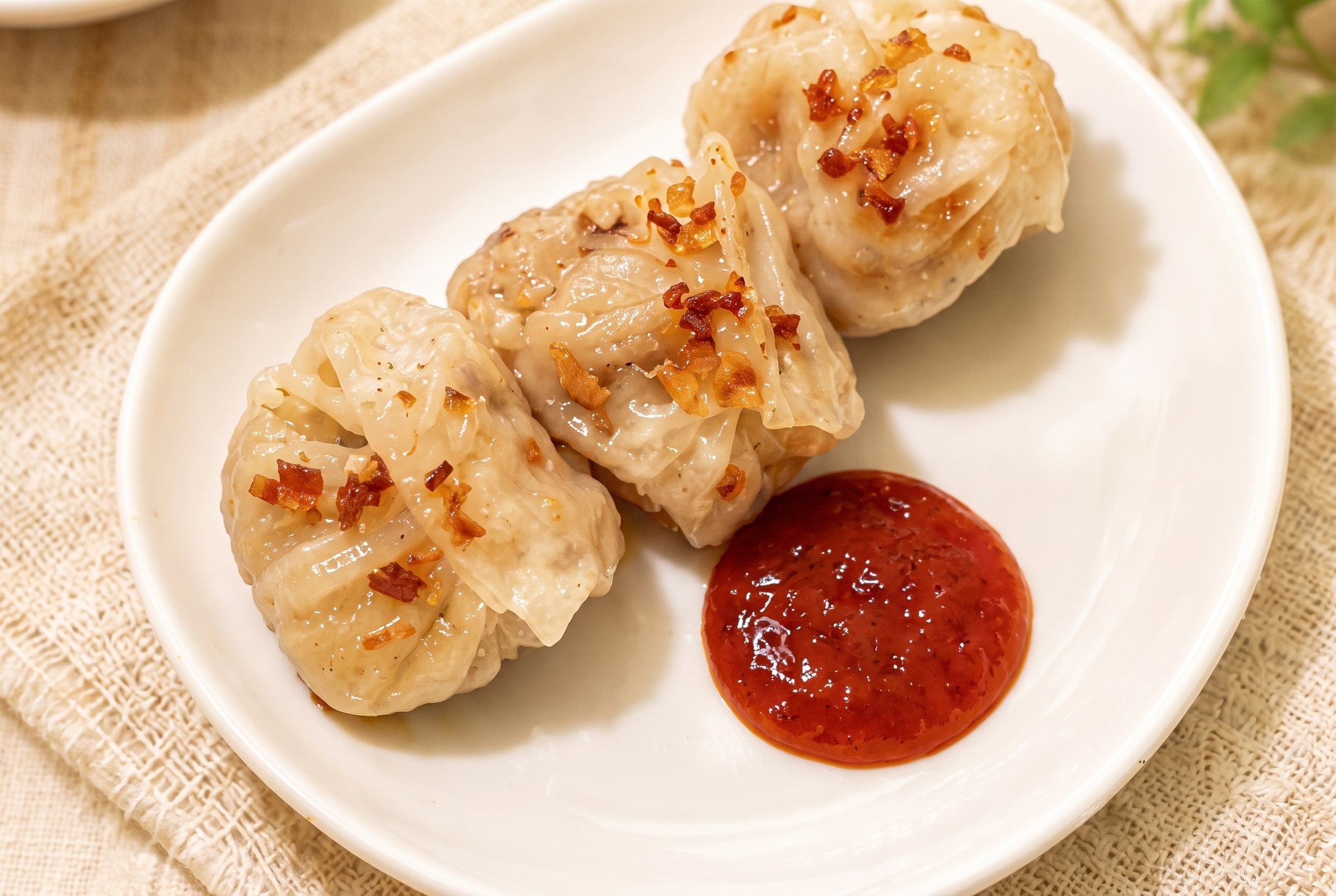 Handmade crystal dumplings with chilli sauce